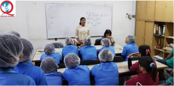 Brifing workers at the factory in Malaysia.